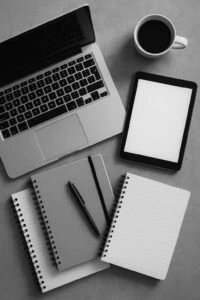 Search engine marketing workspace with laptop, smartphone, and digital advertising tools