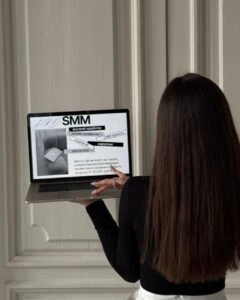Social media marketing professional analyzing online campaign performance on a computer